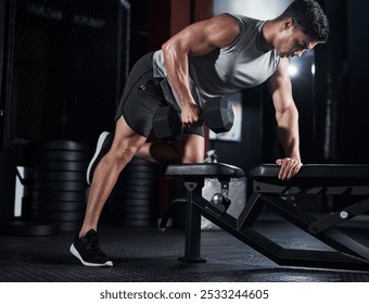 Man, weightlifting and dumbbell as bodybuilder or athlete in sports practice, training and gym. Male person, equipment and routine for challenge, muscle and wellness in workout, fitness and exercise - Powered by Shutterstock