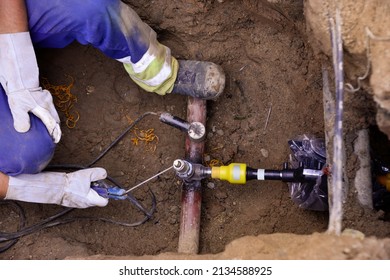 Man Welding A Gas Pipe - New House Connection