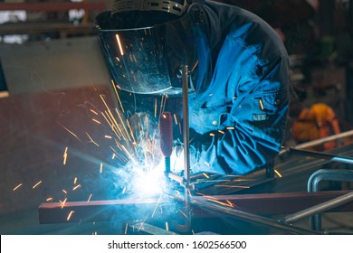 Man Welding in Workshop Sparks Metalwork Construction Industrial - Shutterstock ID 1602566500