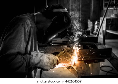 Man welding work,Welding steel sparks - Shutterstock ID 442104559