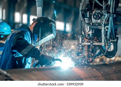 man welds at the factory - Shutterstock ID 539932939