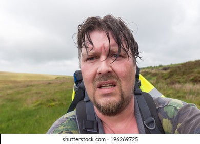 Man With Wet Hair And Sweaty Face Looking Exhausted And Challenged