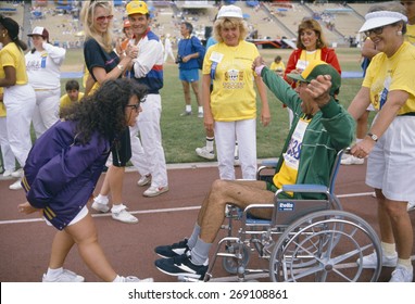 A Man In A Wheelchair Competes At The Special Olympics, 