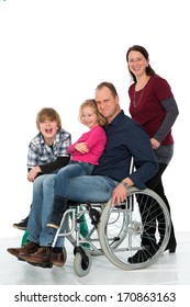 Man In Wheelchair With Family