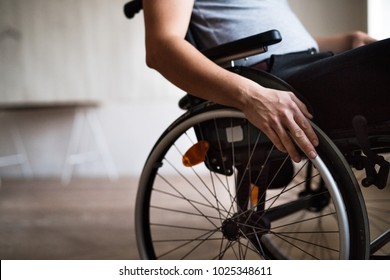 Man In Wheelchair At Home Or In Office.