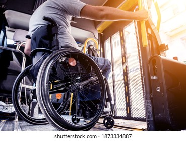 A man in a wheelchair inside of a specialized vehicle 