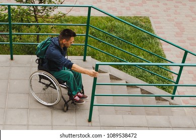 Man In A Wheelchair Using A Ramp