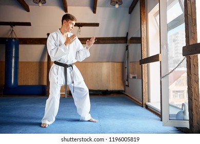 Man In White Kimono Training Karate