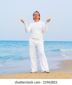 Man in white praying