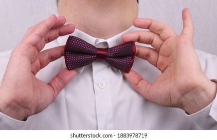 Man In White Shirt And Burgundy Bow Tie