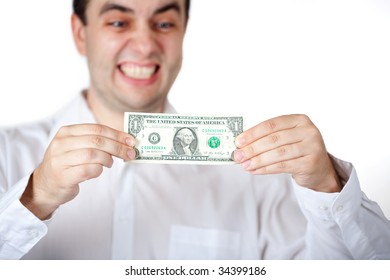 Man in white shirt holding/stretching dollar.