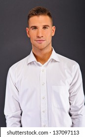 Man With White Shirt Over Dark Background