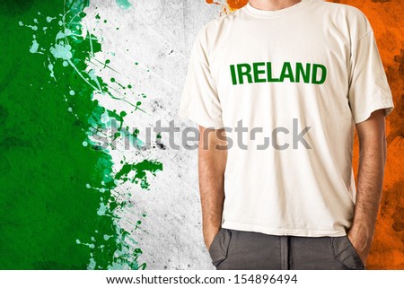 Man in white shirt with title IRELAND, irish flag in background Stock photo © 