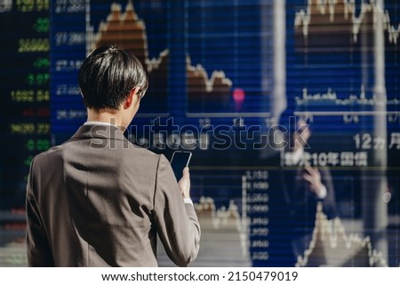 A man who checks the Nikkei Stock Average