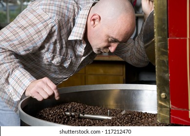 The Man Who Roasts Coffee Beans Takes A Big Smell Of His Work