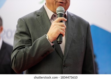 Man who speaks with a microphone - Shutterstock ID 1834473610