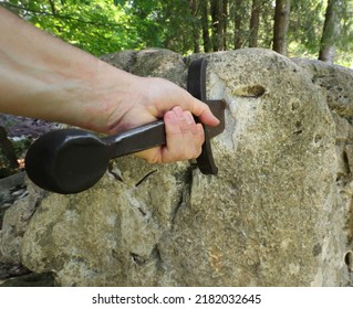 man who tends to perform the legendary feat of extracting the sword stuck in the rock in the middle of the forest of trees