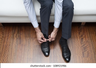 Man Who Ties His Black Shoes