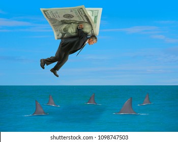 Man with wings made of money flying over school of sharks representing financial success, stock market advice, survival, retirement savings, planning, business strategies, finance & higher education.