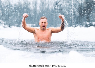 Man winter swimming in ice cold water