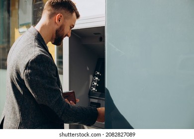 Man Withdrawing Money From Atm