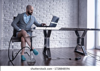 man without pants in working on a computer, laptop, humor coronavirus remote work in underpants