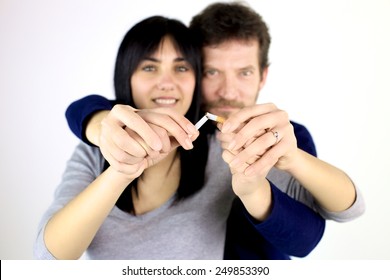 Man And Woman Breaking Cigarette Quitting Smoke