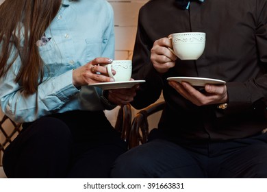 Man And Woman In Business Suits Are Drinking Tea (coffee)