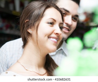 
man and woman buying  bouquet at  flower shop - Powered by Shutterstock