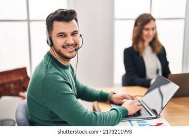 Man And Woman Call Center Agent Using Laptop Working At Office