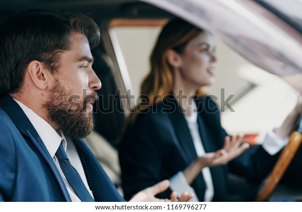 man and woman in the car saloon discuss something    \
                     