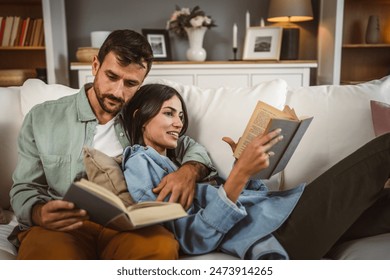 man and woman caucasian adult couple read books at home on sofa bed	 - Powered by Shutterstock