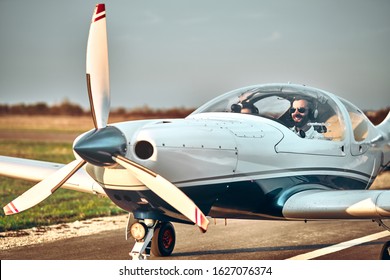Man and woman in the cockpit of a light aircraft. Ready take off - Powered by Shutterstock