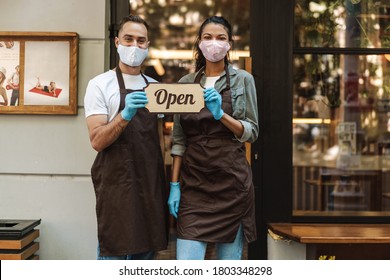 Man And Woman Coffee Shop Owners With Face Mask Open After Lockdown Quarantine