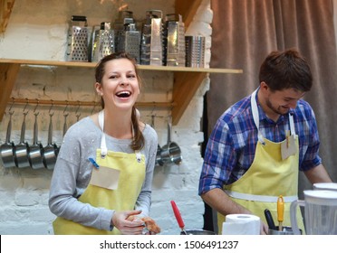 Нappy Man And Woman Cooking And Talking In The Kitchen. Culinary, Food And People Concept/A Couple Cook On The Kitchen. Cooking Class.