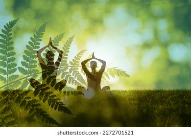 Man woman couple practices yoga and meditates in green nature setting. Concept of meditation, dreaming, wellbeing and healthy lifestyle - Powered by Shutterstock