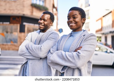 Man And Woman Couple Smiling Confident Standing With Arms Crossed Gesture At Street