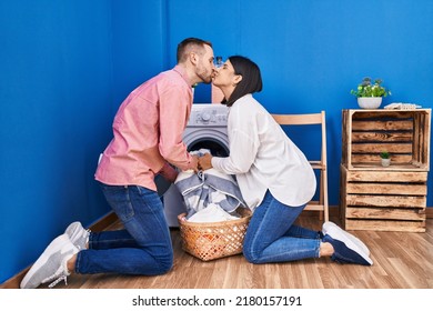 Man And Woman Couple Washing Clothes Kissing At Laundry Room