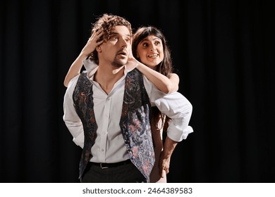 A man and woman dancing gracefully together during theater rehearsals. - Powered by Shutterstock