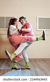 A Man And A Woman Dancing Lindy Hop In A Dance Studio