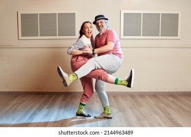 A Man And A Woman Dancing Lindy Hop In A Dance Studio