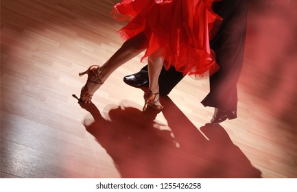 Man And Woman Dancing Salsa On Dark