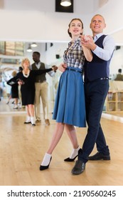 Man And Woman Dancing Waltz In Studio