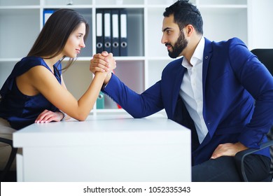 Man And Woman Doing Arm Wrestling