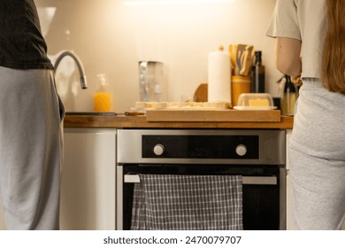 Man and woman doing dishes together in kitchen. Young couple making Breakfast together. Concept of gender equality. - Powered by Shutterstock