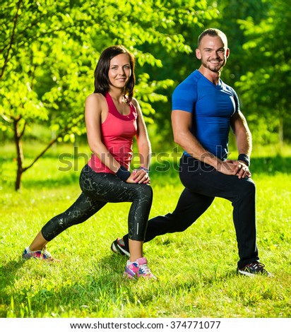 Man and woman doing stretching exercises