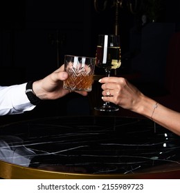 Man And Woman Drinking Wine And Whiskey