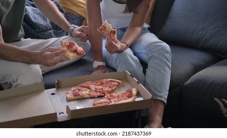 Man And Woman Eat Pizza At Home. Ready Meal Delivery Concept. Fast Food