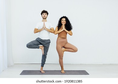 Man and woman engaged in yoga asana sports gymnastics fitness