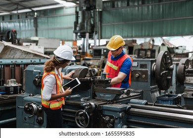 Man and woman engineer industry worker wearing hard hat in factory,teamwork professional industrial. - Shutterstock ID 1655595835